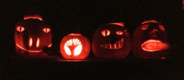 Happy Halloween! Our pumpkins glower on the front porch...