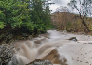 Chocolate cream river: the rain-swollen Huntington River yesterday just before it drops into the Gorge.