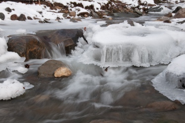 Ice formations seem to float above the flow in Fargo Brook.