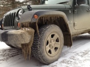 Mud and ice stalactites "decorate" Robin's mail vehicle. Ahhh, March in Vermont!